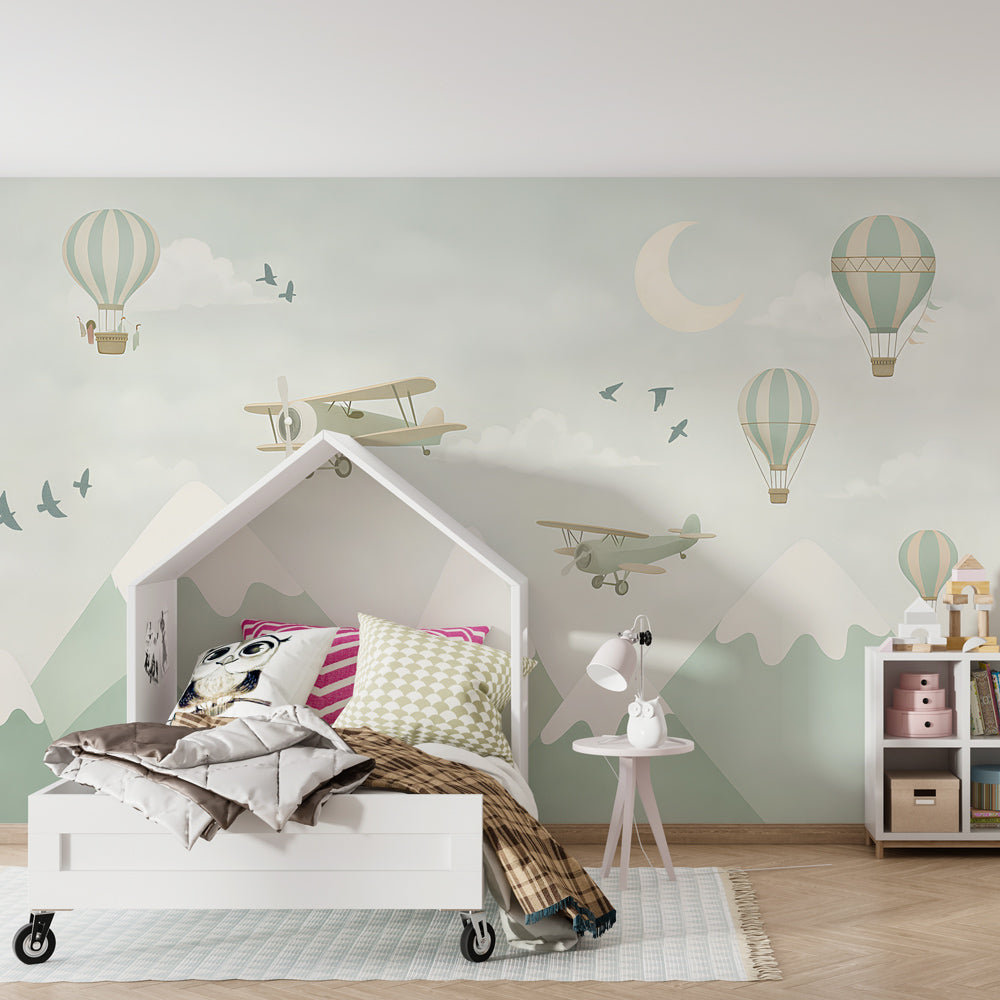 Sky adventure wallpaper creating dreamy atmosphere in children's bedroom with wooden furniture