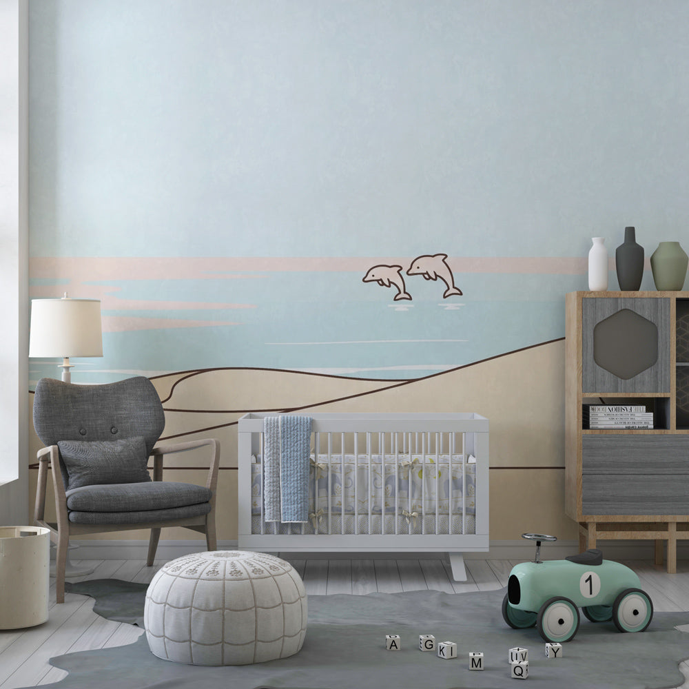 Gentle dunes and dolphins wallpaper transforming modern baby bedroom into seaside retreat