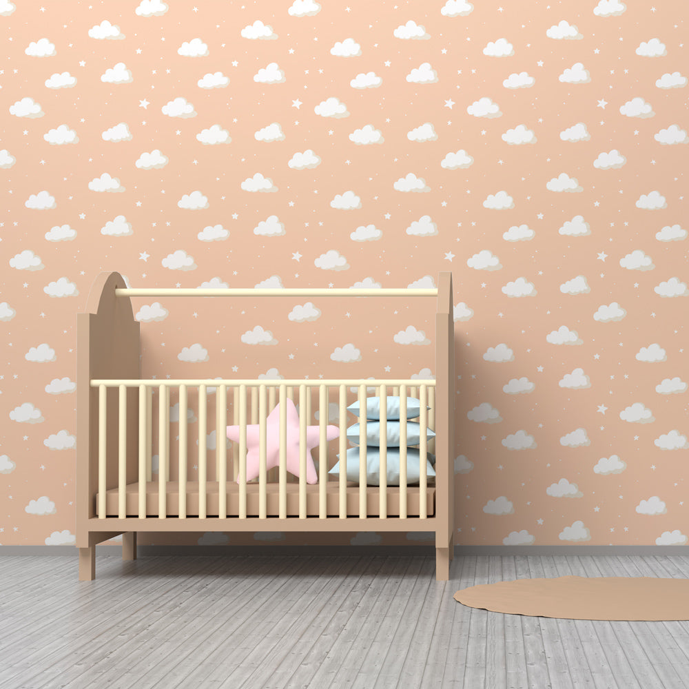 Soft cloud wallpaper creating dreamy atmosphere in children's bedroom with peach background