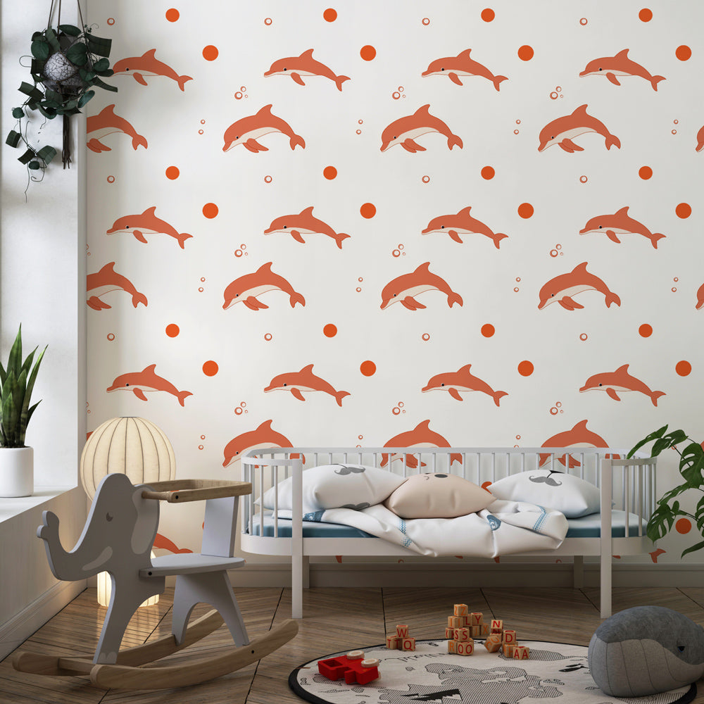 Playful dolphins wallpaper with soft pink tones decorating children's bedroom interior