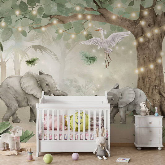 Kids-Mundo elephant family wall mural with fairy lights behind a bed in a cosy kids' bedroom.