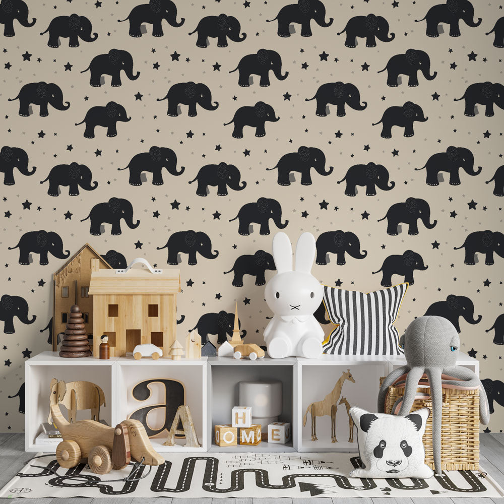 Elephant themed wallpaper in modern baby bedroom with soft lighting and wooden furniture