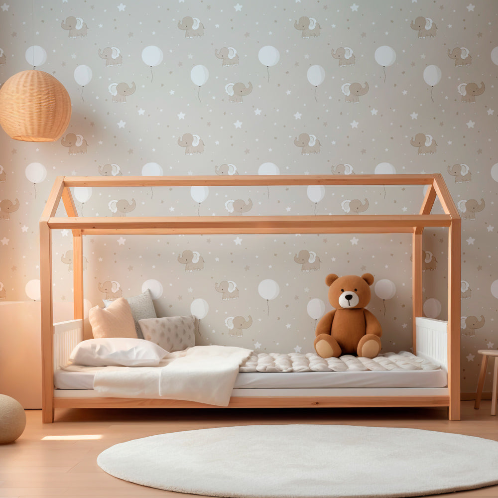Elephant nursery wallpaper creating peaceful baby room atmosphere with beige tones