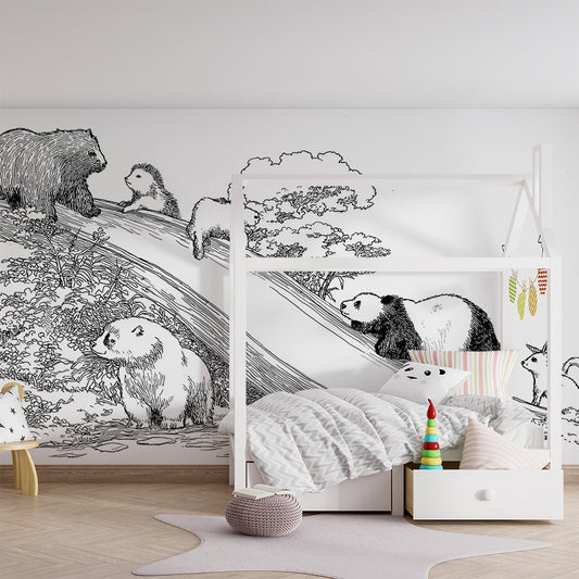 Kids-Mundo hillside wall mural in a kids' bedroom, showing a panda, bear cub and rabbit sliding down the hill