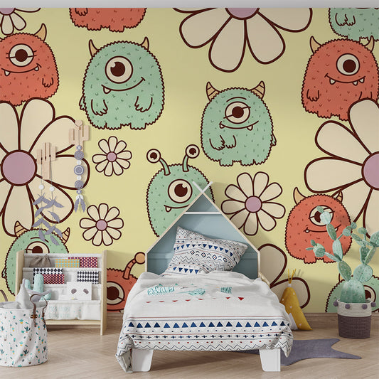 Kids-Mundo friendly monster wall mural behind a bed in a colourful kids bedroom.