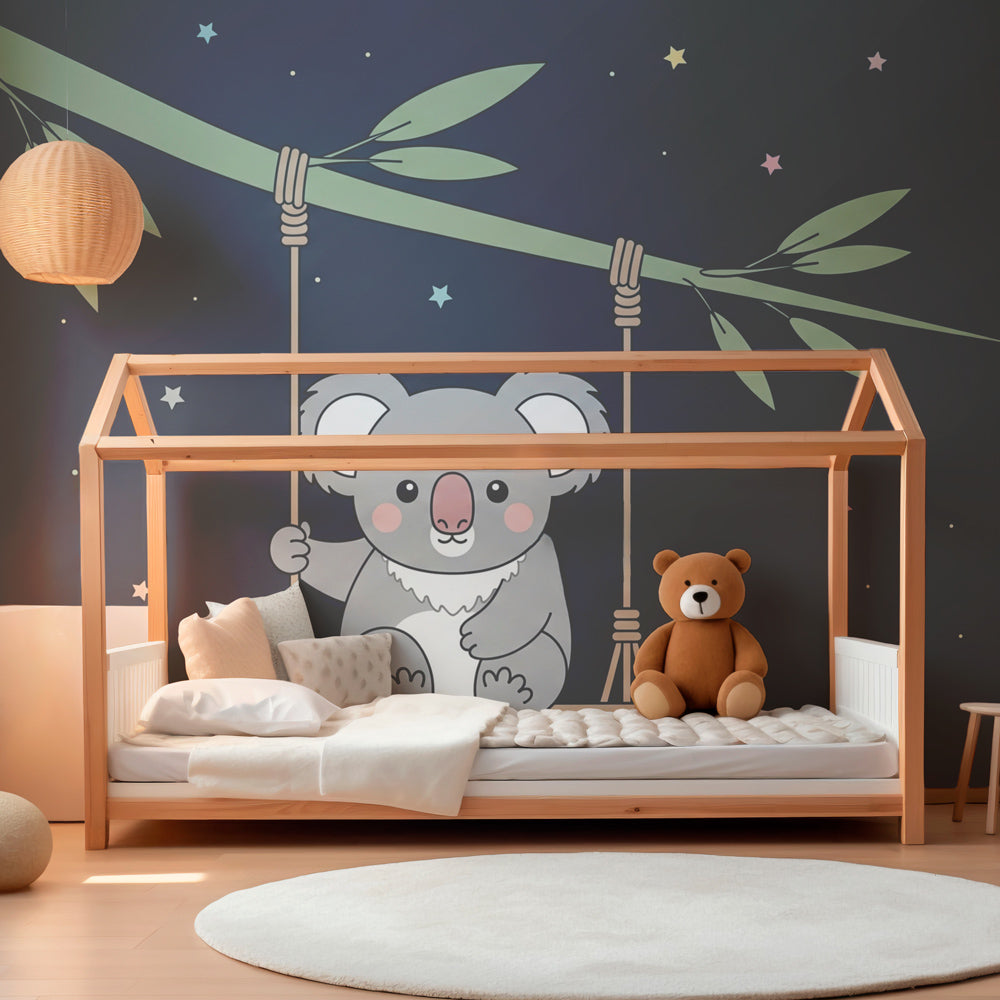 Peaceful koala mural wallpaper creating dreamy atmosphere in children's bedroom with moon and stars theme