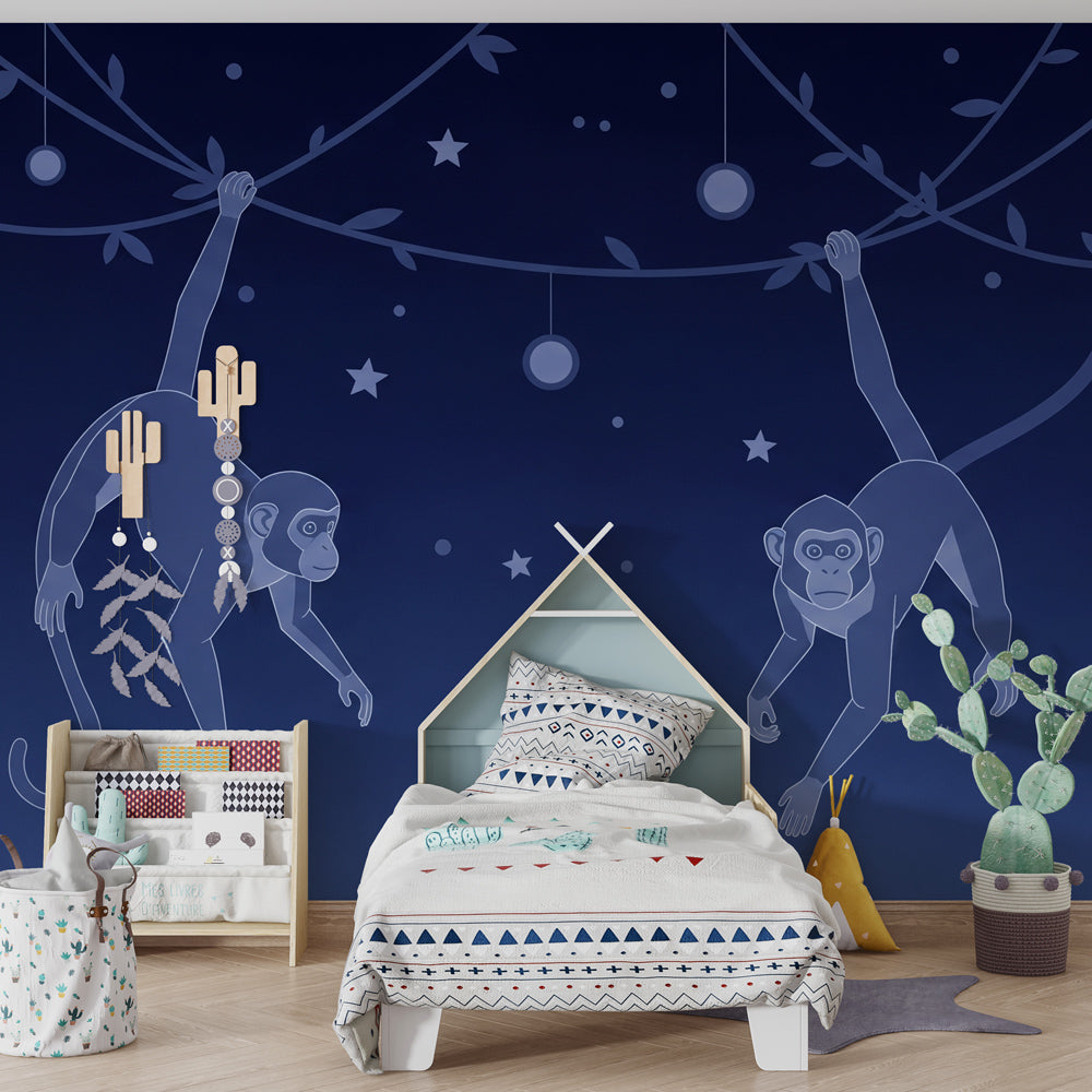 Starry night monkey wallpaper creating magical kids bedroom atmosphere with wooden furniture