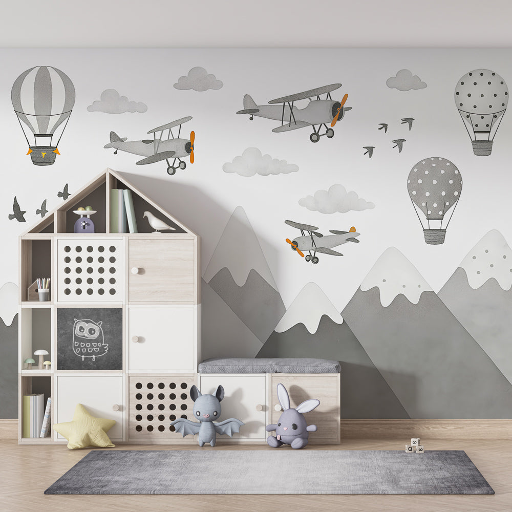 Aviation themed wallpaper creating adventurous kids bedroom decor with mountain landscape