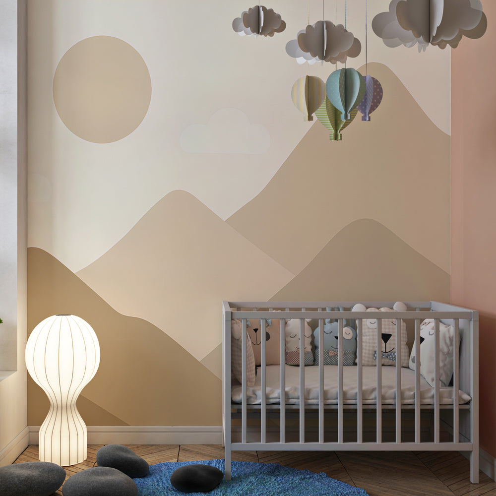 Soft beige mountain mural wallpaper creating calming atmosphere in children's bedroom decor