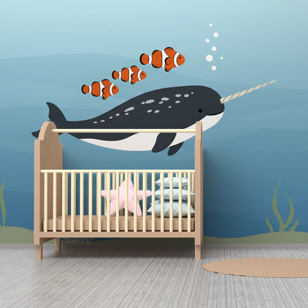 Underwater mural wallpaper featuring narwhal and clownfish in calming blue nursery decor