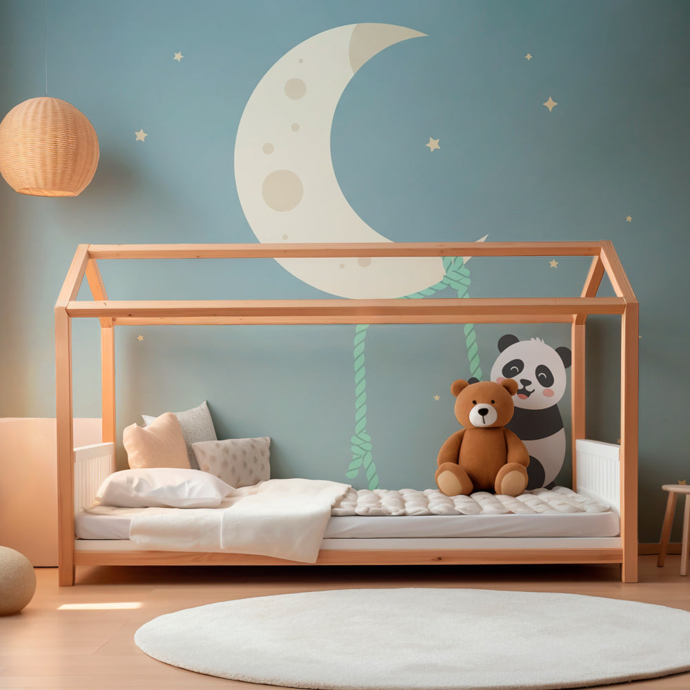 Charming panda climbing to moon wallpaper installed in modern baby bedroom with wooden furniture