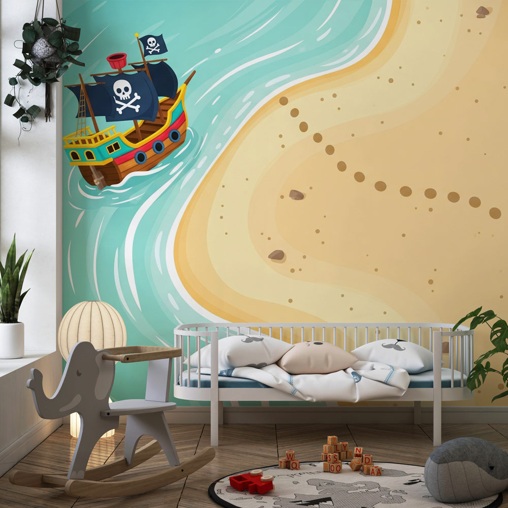 Treasure hunt themed mural wallpaper with pirate ship and golden beach scene in cozy nursery setting