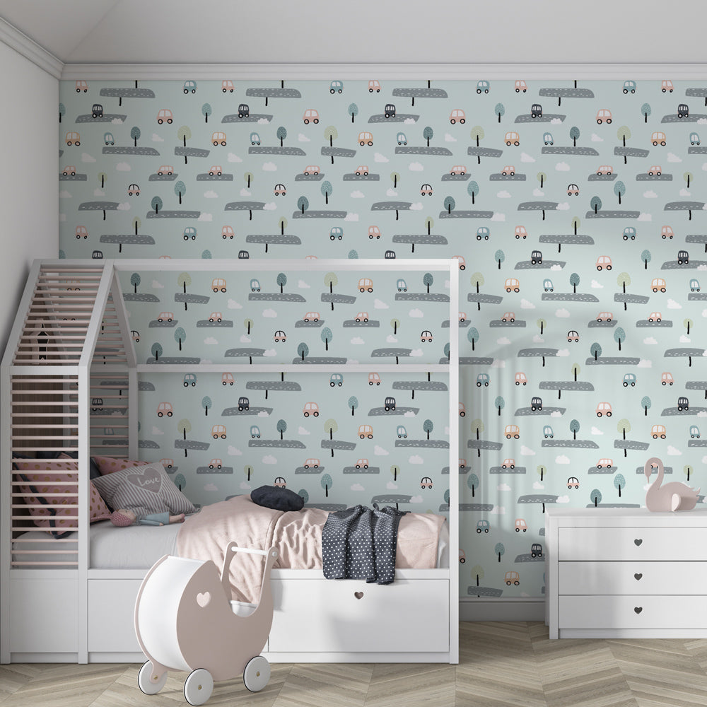 Children's bedroom featuring road theme wallpaper with winding paths and cute cars