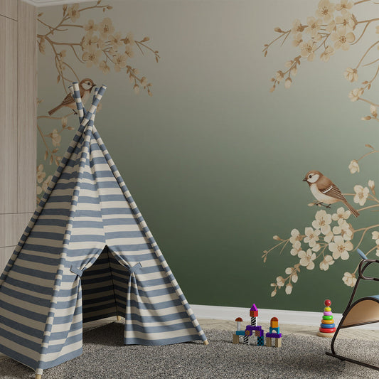 Kids-Mundo blossom tree branch mural behind a cot bed in a gentle green kids bedroom.