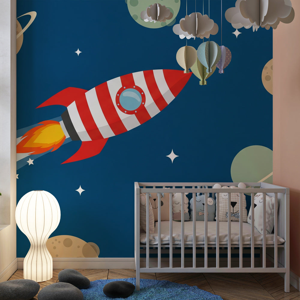 Colorful space rocket wallpaper creating cosmic adventure atmosphere in children's nursery