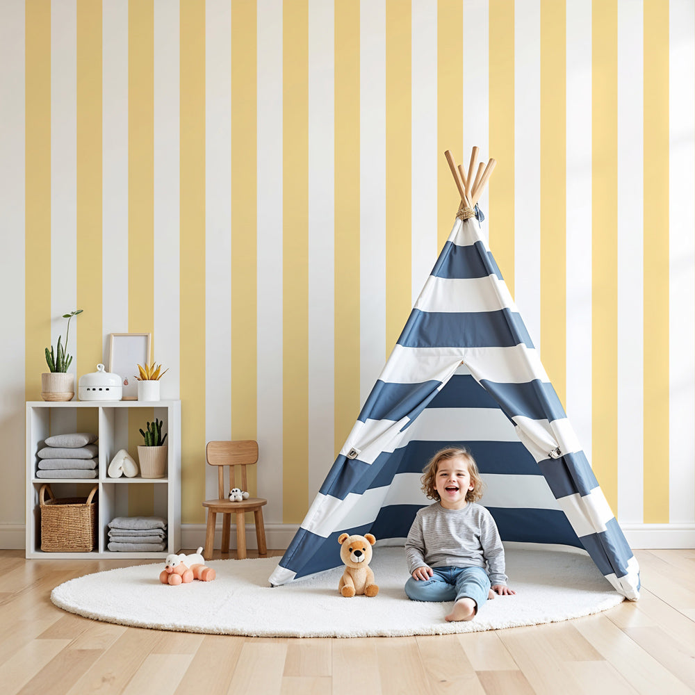 Soft yellow striped mural wallpaper in modern baby nursery with white crib by Kids-Mundo