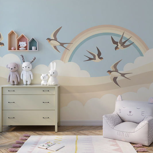 Kids-Mundo swallow and rainbow wall mural in a child's bedroom, adding a calm, airy feel above the bed.
