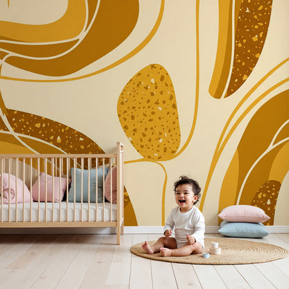 Kids-Mundo abstract golden swirls wall mural above a cot in a warm-toned nursery