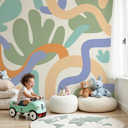 Kids-Mundo abstract organic shapes wall mural in a bright nursery with orange and blue swirl accents.