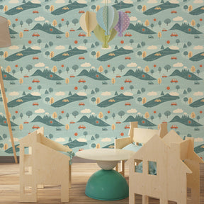 Nature adventure mural wallpaper in modern kids bedroom with colorful cars and hills by Kids-Mundo