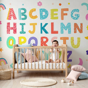 Colorful alphabet mural wallpaper creating educational nursery decor with rainbow letters by Kids-Mundo
