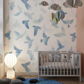 Soft blue watercolor birds wallpaper transforming baby room into celestial sanctuary