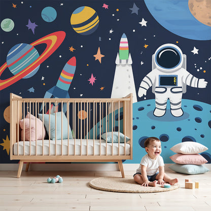 Kids-Mundo astronaut and planets wall mural styled above a cot in a bold navy blue nursery