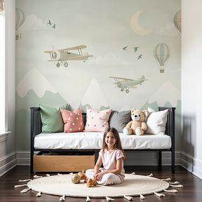 Aviation mural wallpaper with planes and hot air balloons in modern nursery by Kids-Mundo