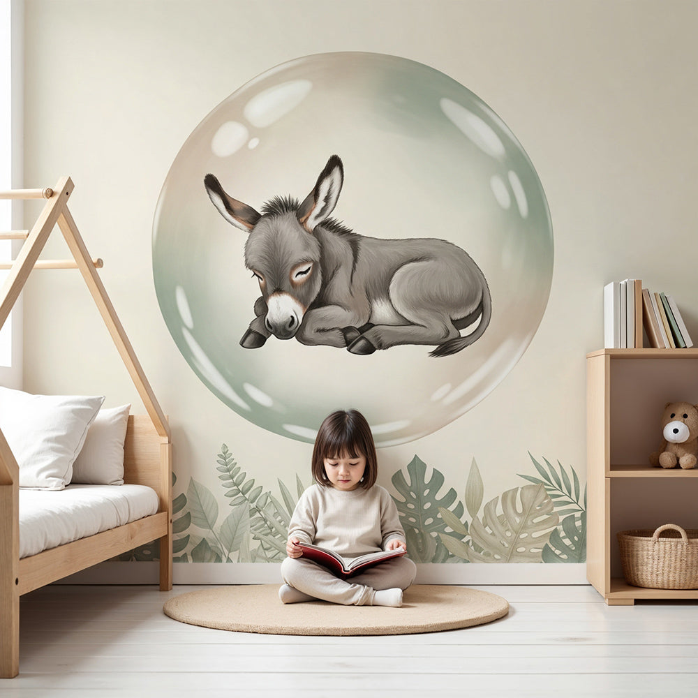 Kids-Mundo sleeping baby donkey wall mural behind a cot in a soft, neutral nursery