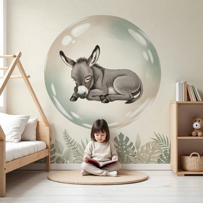Kids-Mundo sleeping baby donkey wall mural behind a cot in a soft, neutral nursery