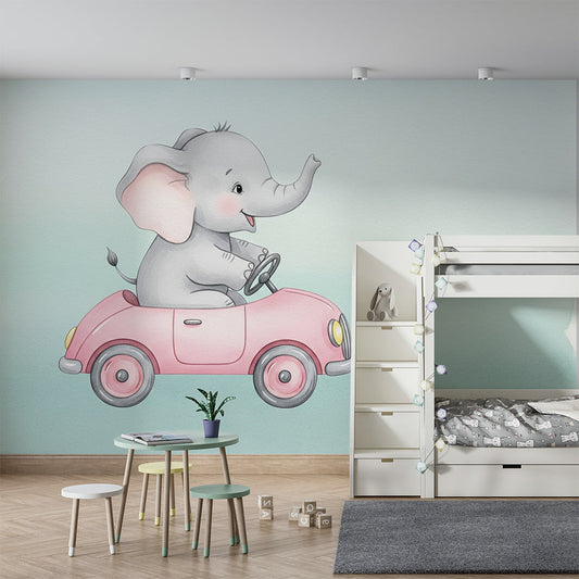 Kids-Mundo elephant and pink car wall mural brightening a toddler's kids bedroom wall behind a bed.