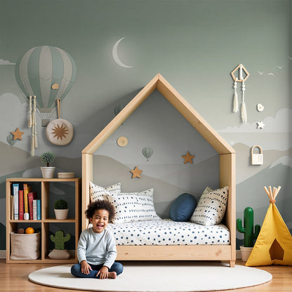 Kids-Mundo hot air balloon and moon wall mural above a cot in a soft nursery