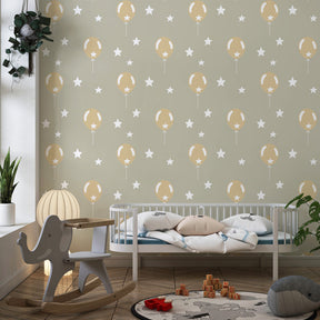 Balloon themed mural wallpaper in modern kids bedroom with dreamy golden design