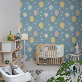 Festive balloon wallpaper creating joyful atmosphere in children's bedroom with blue background
