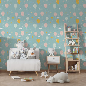 Pastel balloon wallpaper creating dreamy atmosphere in children's bedroom decor