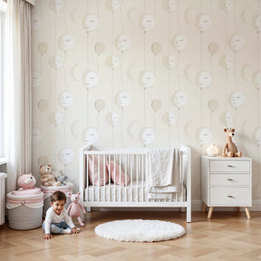 Whimsical balloon mural wallpaper with gentle faces in modern nursery by Kids-Mundo