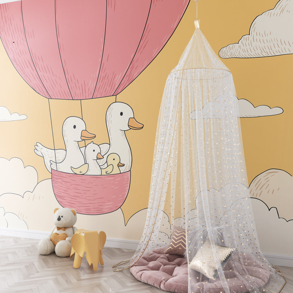 Pink hot air balloon nursery wallpaper with clouds in peaceful baby room setting