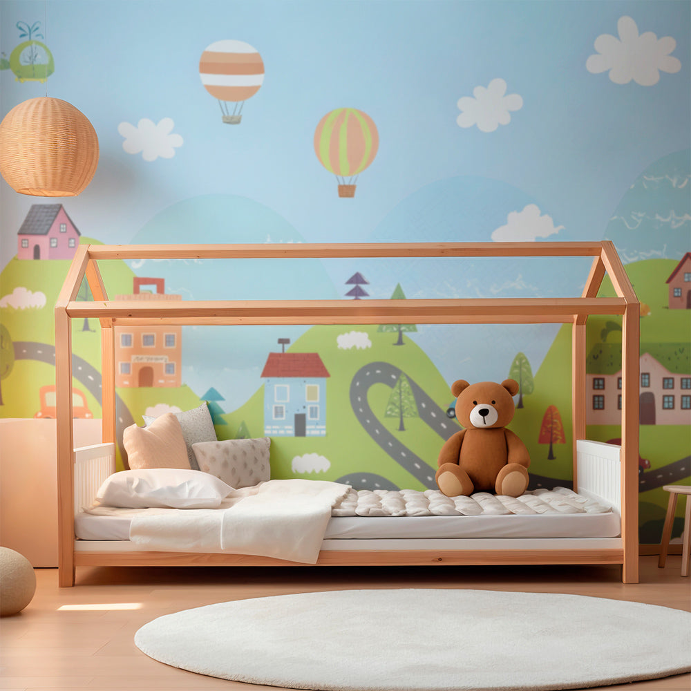 Kids-Mundo balloon town wall mural behind a bed in a cheerful kids bedroom
