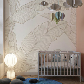 Nature-inspired banana leaf wallpaper in modern kids bedroom with neutral tones