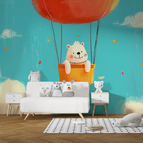 Cute bear balloon wallpaper creating adventure-themed nursery decor with blue sky background
