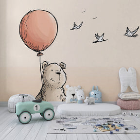 Pastel bear mural wallpaper with natural wood furniture in peaceful nursery setting