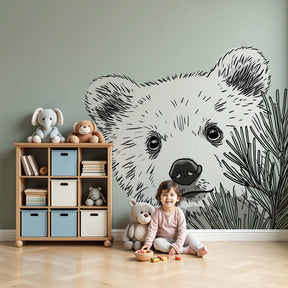 Bear cub mural wallpaper in cozy forest-themed nursery with wooden furniture by Kids-Mundo