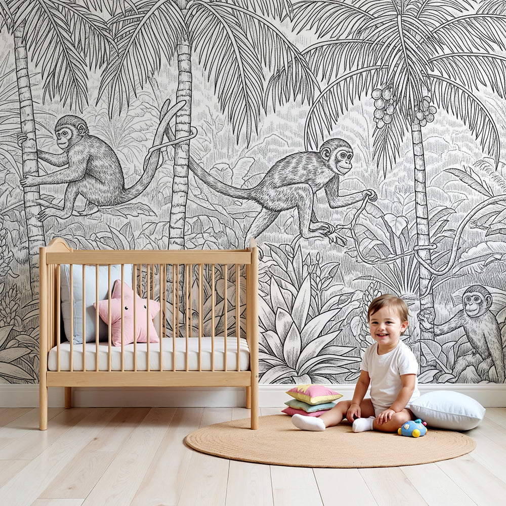 Kids-Mundo black and white jungle monkeys wall mural on a nursery wall behind a cot