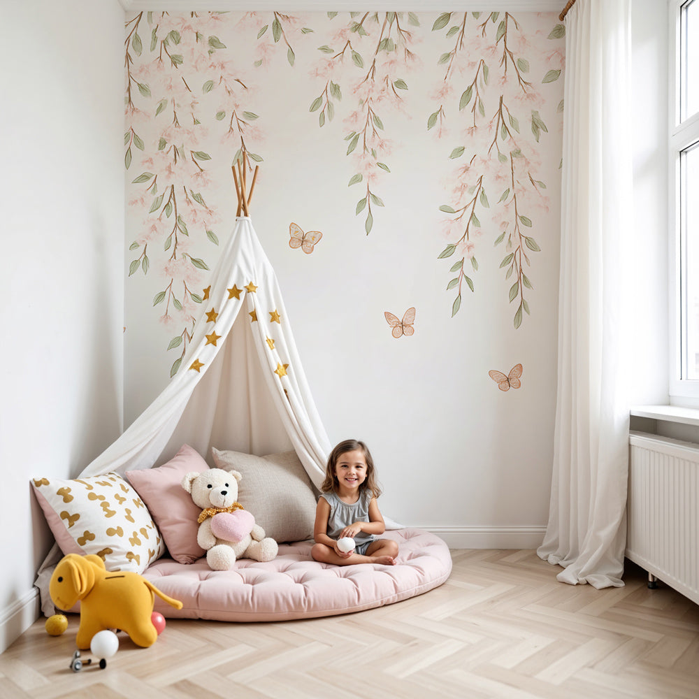 Kids-Mundo pink blossom and butterfly wall mural installed behind a white cot in a soft, sunlit nursery