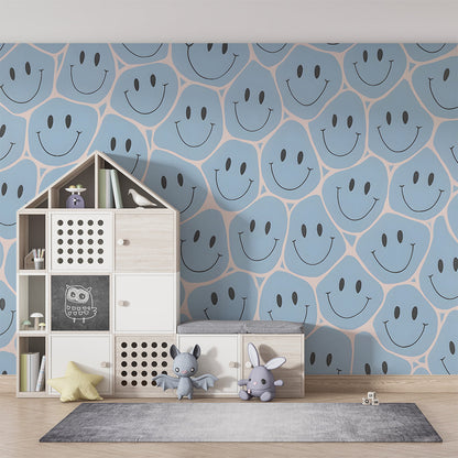 Kids-Mundo blue smiley face wall mural behind a single bed in a cheerful kids' bedroom