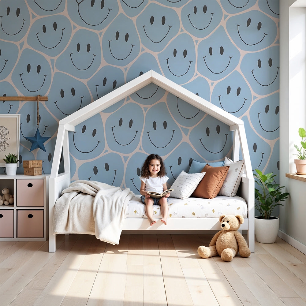 Kids-Mundo blue smiley face wall mural styled in a bright, sunny nursery with a white cot