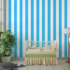 Blue striped mural wallpaper for kids playroom with colorful furniture and toys