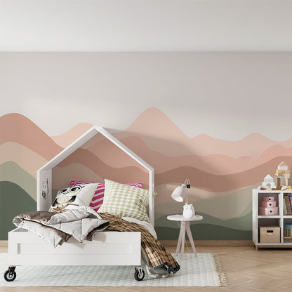 Kids-Mundo wavy mountain wall mural in blush and sage tones brightening a calm playroom wall