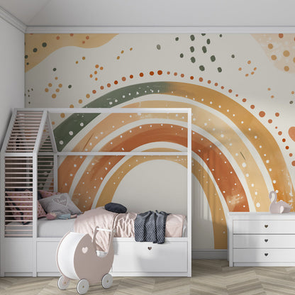 Kids-Mundo boho rainbow wall mural bringing warm colour to a cosy playroom corner.