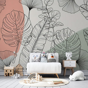 Monstera and ginkgo leaf wallpaper with soft pink-green tones for kids room decor